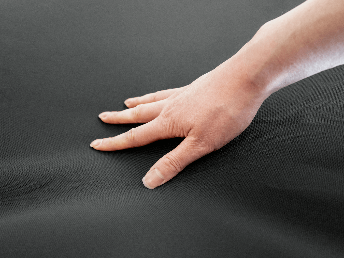 Close-up of upgraded high-tension fabric for Model Y sunshade. Material engineered to resist sagging over time and maintain structural tautness through high-frequency daily use.